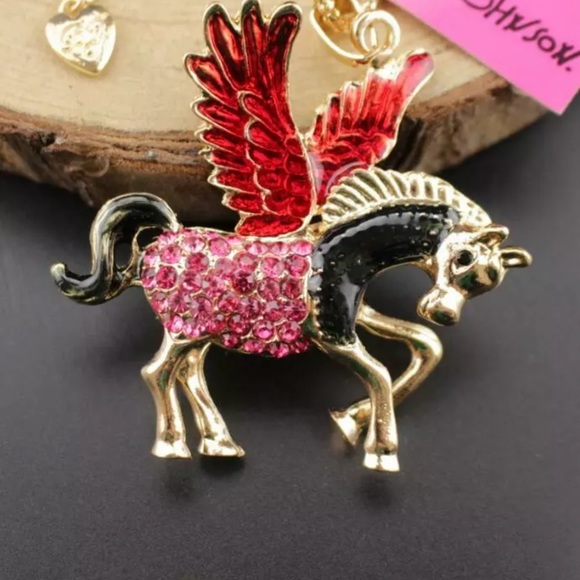 Betsey Johnson Jewelry - Betsey Johnson wing angel red pink horse necklace